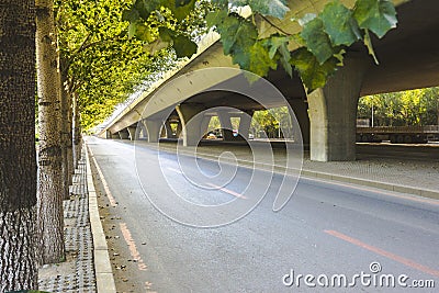 Asphalt roads and city buildings under the overpass, automobile advertising road material. Stock Photo